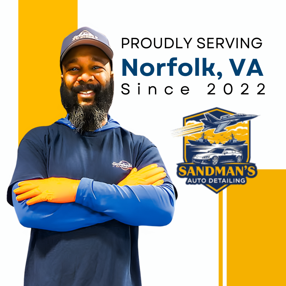 Auto detailer smiling with Norfolk logo
